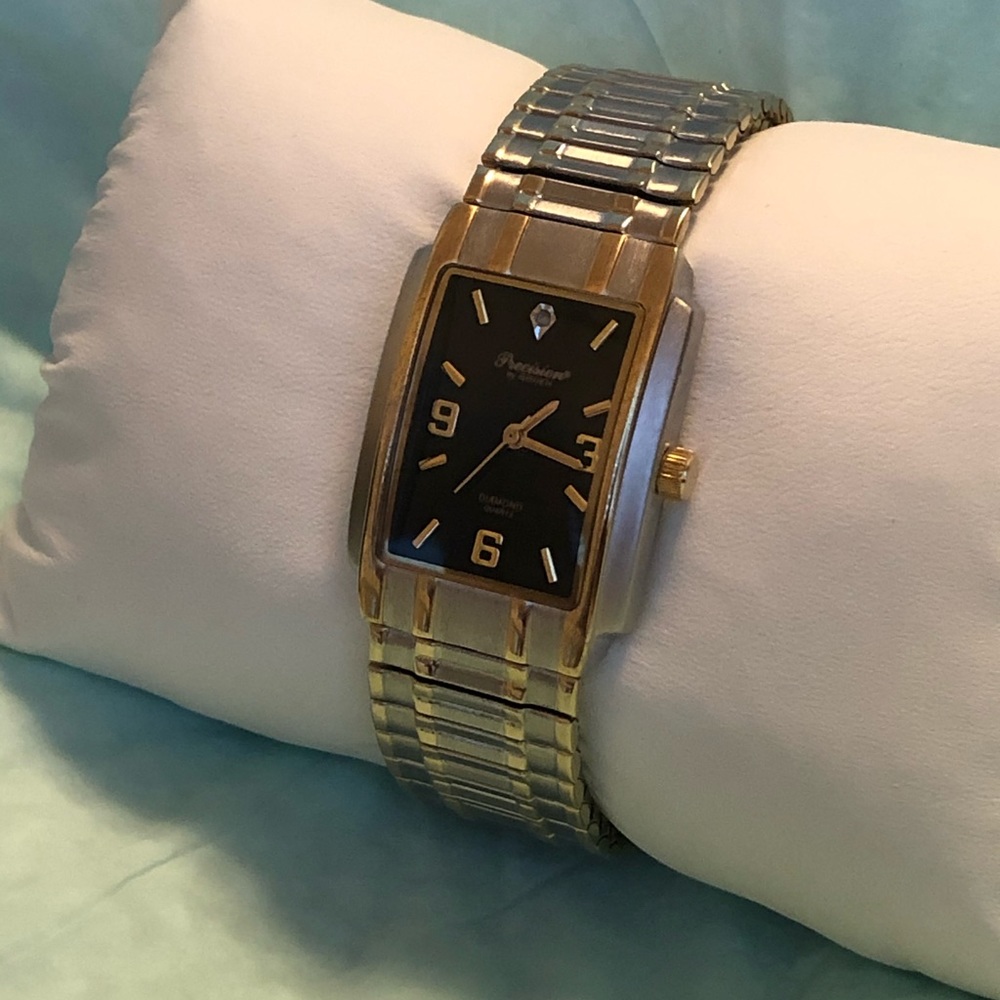 Gold, Silver and black watch with diamond accent